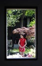 Chinese woman in cheongsam in Mudu ancient town, the picture looks like picture in picture