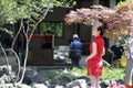 Chinese woman in cheongsam in Mudu ancient town, the picture looks like picture in picture