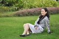 A Chinese Woman On The Grass