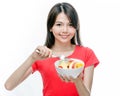 Chinese woman holding bowl of fruit