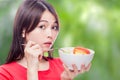 Chinese woman holding bowl of fruit Royalty Free Stock Photo