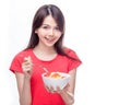 Chinese woman holding bowl of fruit Royalty Free Stock Photo