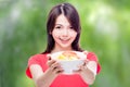 Chinese woman holding bowl of fruit Royalty Free Stock Photo