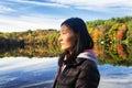 Chinese woman looking at the morning sun in autumn