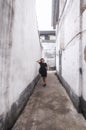 Chinese woman narrow alleys shaoxing china