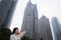 Chinese woman near skyscrapers Royalty Free Stock Photo