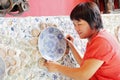 Chinese woman and old porcelain