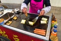 Chinese woman preparing a tofu meal. Outdoor. Asian street food. Suzhou China