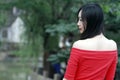A Chinese woman in red dress in Feng Jing ancient town Royalty Free Stock Photo
