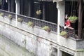 A Chinese woman in red dress in Feng Jing ancient town Royalty Free Stock Photo