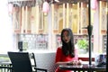 A Chinese woman in red dress in Feng Jing ancient town