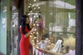 A Chinese woman in red dress in Feng Jing ancient town Royalty Free Stock Photo