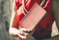 Chinese woman in red holding a blank cover book for mock up Royalty Free Stock Photo