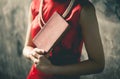 Chinese woman in red is holding a blank cover book for mock up Royalty Free Stock Photo