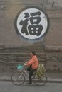 Chinese woman riding a bike