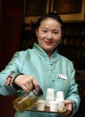 Chinese woman selling Chinese Tea