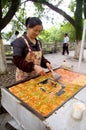 Chinese woman selling tofu on street