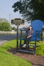 Chinese woman sitting in a large blue chair