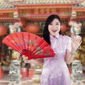 Chinese woman with traditional cheongsam dress