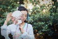 Chinese woman in traditional Hanfu dress play in a garden Royalty Free Stock Photo