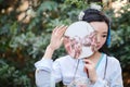 Chinese woman in traditional Hanfu dress play in a garden Royalty Free Stock Photo