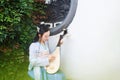 Chinese woman in traditional Hanfu dress,play traditional instrument of pipa Royalty Free Stock Photo