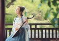 Chinese woman in traditional Hanfu dress,play traditional instrument of pipa Royalty Free Stock Photo