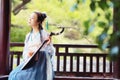 Chinese woman in traditional Hanfu dress,play traditional instrument of pipa Royalty Free Stock Photo