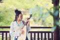 Chinese woman in traditional Hanfu dress,play traditional instrument of pipa