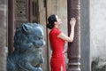 Chinese woman in traditional red cheongsam