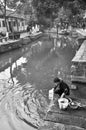 Chinese woman washing her stuff in tongli river