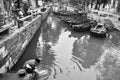 Chinese woman washing her stuff in tongli river
