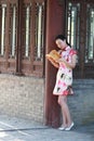 A Chinese woman wears Cheongsam in the water park of Shanghai Royalty Free Stock Photo