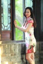 A Chinese woman wears traditional dress in the water park of Shanghai