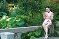 A Chinese woman wears traditional dress in the water park of Shanghai Royalty Free Stock Photo