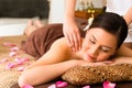 Chinese Woman at wellness massage with essential oils Royalty Free Stock Photo