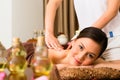 Chinese Woman at wellness massage with essential oils Royalty Free Stock Photo