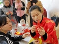 Chinese women learn to do chinese lucky knotting