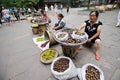 Chinese Women selling walnuts