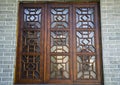 Chinese wooden windows on the brick wall.