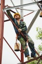 Chinese worker painting steel structure