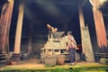 Chinese workers grinding grain product