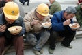 Chinese workers have lunch