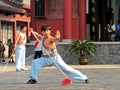 Chinese young man practicing chinese kung-fu with the spear