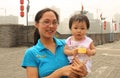 Chinese young woman with her baby Royalty Free Stock Photo