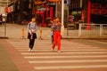 Chinese young women crossing the road