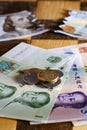 Chinese yuan money and US dollars against the background of chess. Dollar bills and yuan coins from China on a chessboard