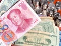Chinese Yuan Note In Front Of US Dollar Notes