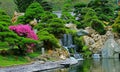 Chinese zen garden with water fall and cascade plants Royalty Free Stock Photo