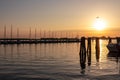 Chioggia - Beautiful sailing boats gracefully adorn the picturesque port of the charming town of Chioggia at sunrise Royalty Free Stock Photo